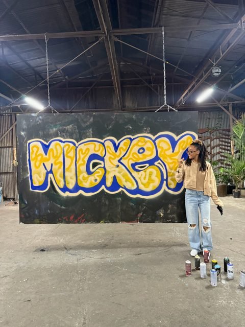 Workshop guest with yellow and blue MICKEY graffiti lettering